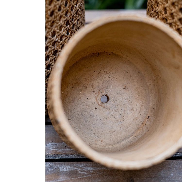 Close-up of a terracotta pot with a textured background
