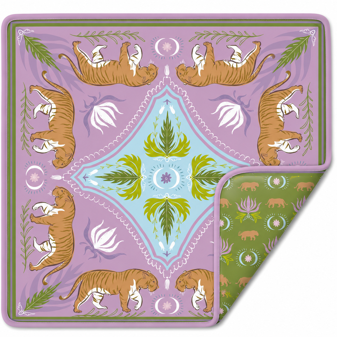 A double-sided mahjong mat.The top side features a lavender field with four orange-and-white tigers, white floral motifs, and a central light blue diamond with green leaves.